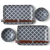 Blue and white shippou pattern on a ceramic sushi for two set made in Japan available at Miya.