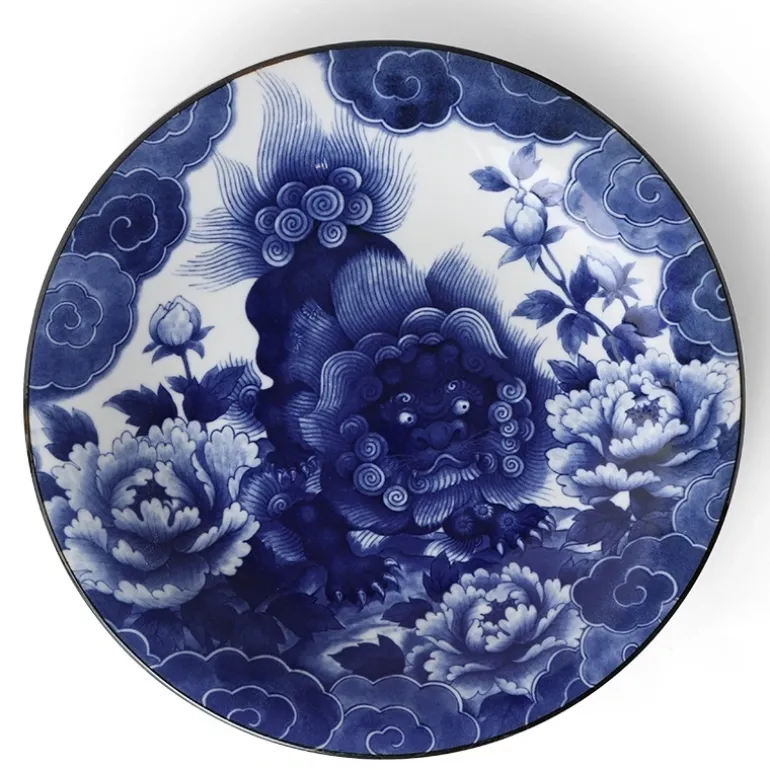 Komainu lion dog design on a blue and white serving plate made in Japan available at Miya.